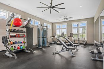 24/7 Fitness center with cardio and weight training
